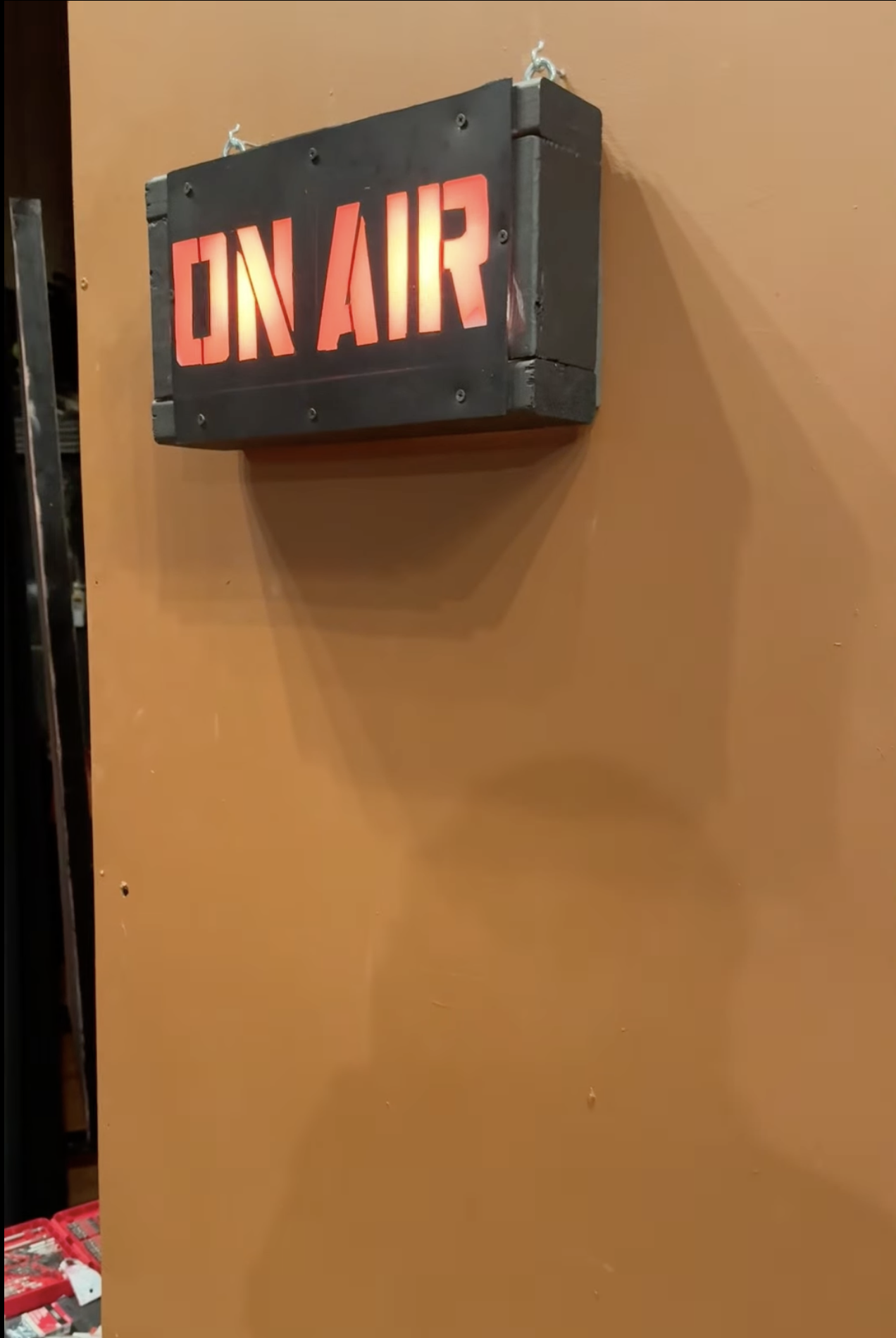 An On Air sign is pictured somewhere on the stage, and let up red.