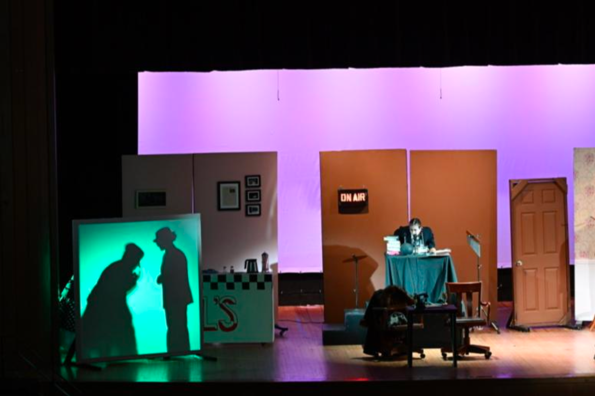 An On Air sign is pictured somewhere on the stage, and let up red.