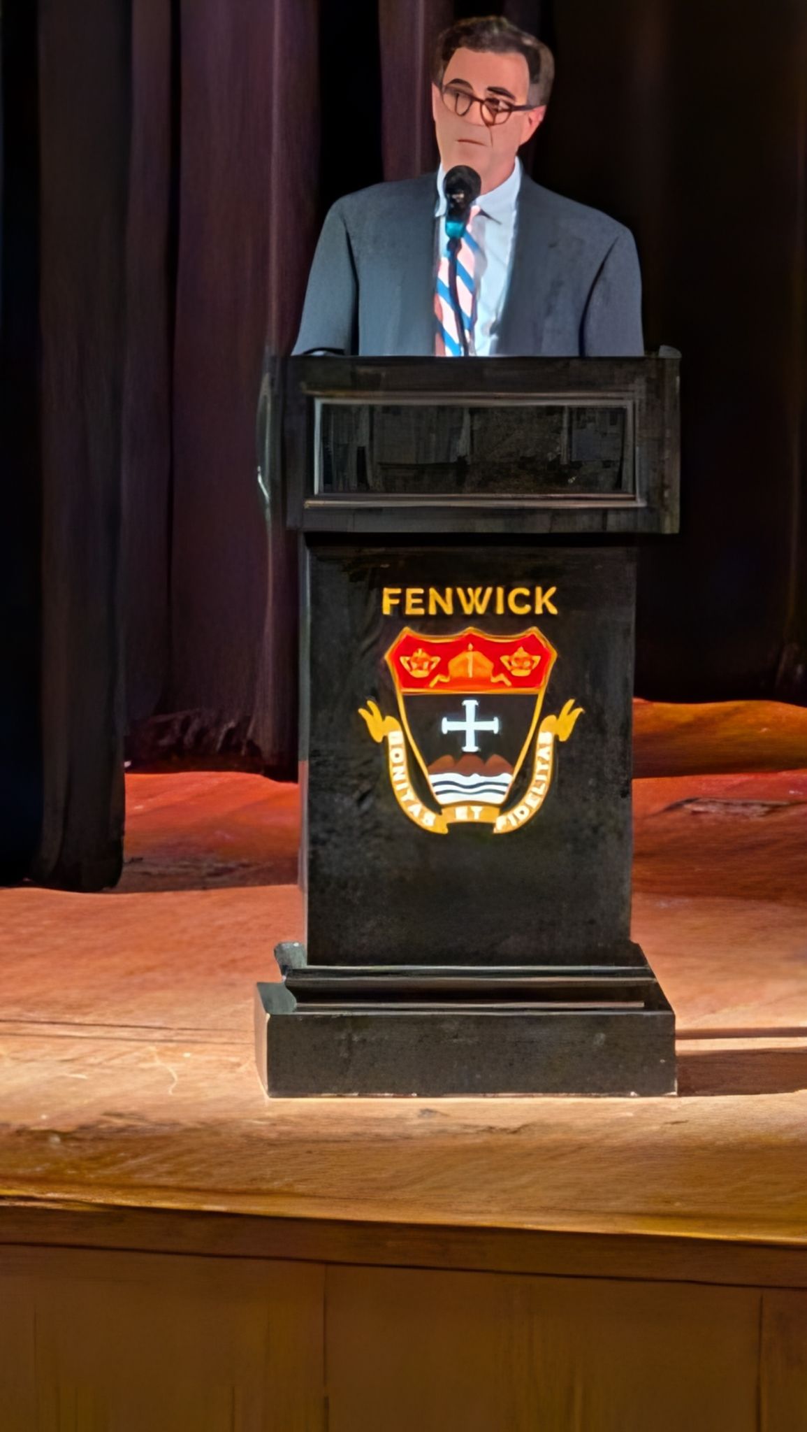A speaker stands at a Fenwick podium at SR.