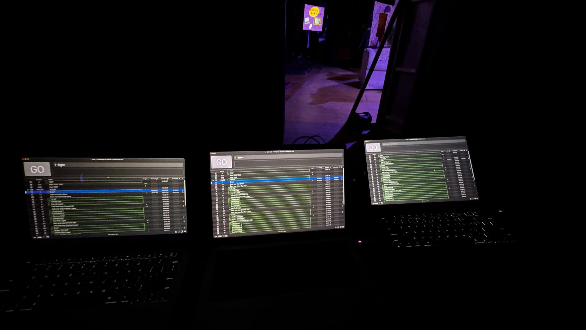Three MacBooks simultaneously running QLab files for Make 'Em Laugh.